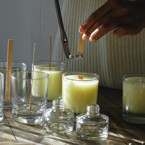 candle wick being trimmed while learning how to make scented candles